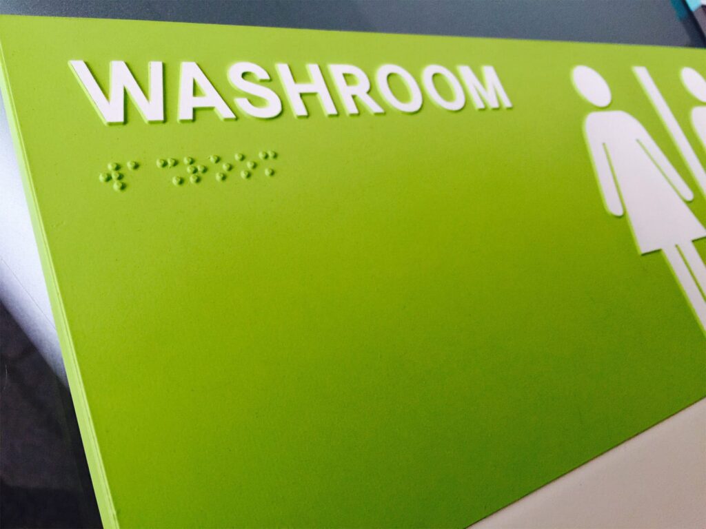 Unisex washroom sign
