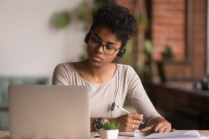 Woman presenting information during an ADA compliance webinar.