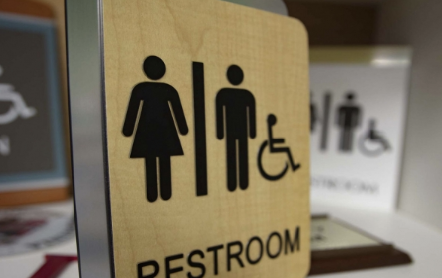 A modern, ADA compliant gender neutral restroom sign, clearly marked to ensure accessibility and inclusivity for all individuals.