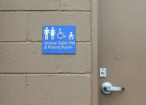 Exterior-grade photopolymer signs mounted on a building facade, providing clear and durable wayfinding.