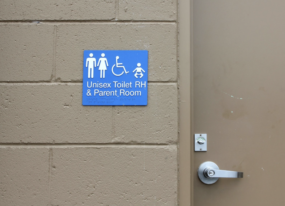 Exterior-grade photopolymer signs mounted on a building facade, providing clear and durable wayfinding.