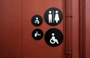 Adhesive-to-substrate matrix used for mounting ADA-compliant signs, ensuring secure installation on various surfaces while meeting accessibility standards.