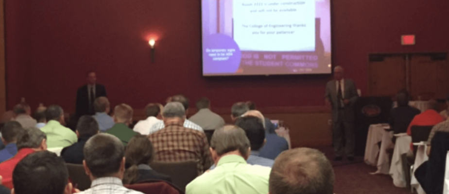 ADA accessibility code education at a conference for sign architects.