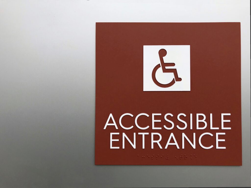 Example of braille signage requirements for ADA compliance in public spaces.