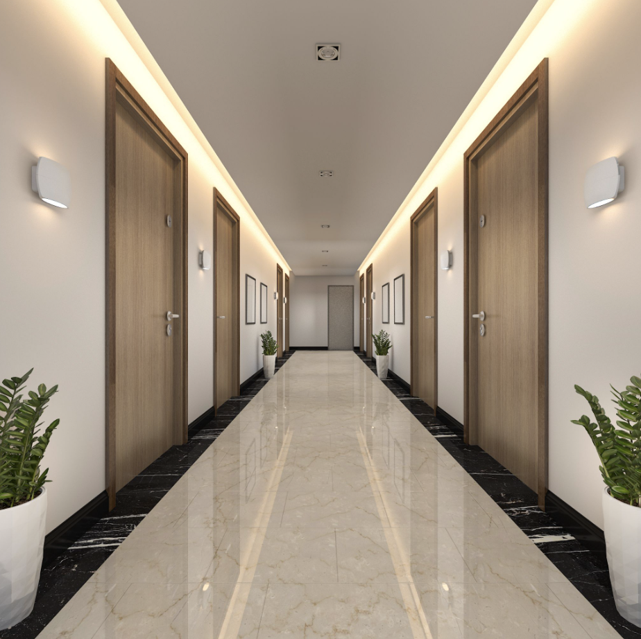 Hotel hallway in need of room numbering with durable photopolymer braille signs.